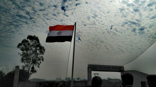 Low angle view of flag against sky