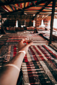 Cropped image of woman hand holding drink