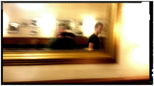 View of illuminated woman in dark