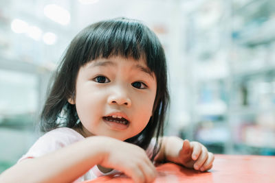 Close-up of cute girl in supermarket