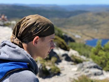 Portrait of man on rock