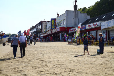 People walking on the cobble landing filey north yorkshire england uk