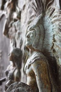 Close-up of angel statue against temple