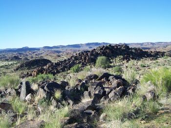 Scenic view of landscape against clear blue sky