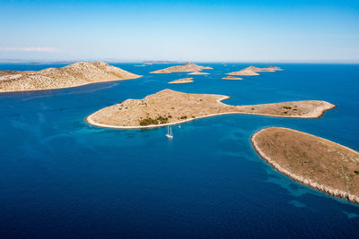 Sailing boat at anchor in the kornati archipelago, drone view