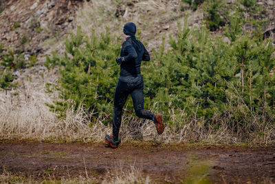 Male runner run dirty trail spring marathon	