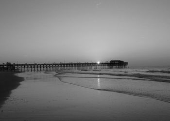 Scenic view of beach against clear sky