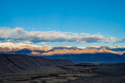 Scenic view of snowcapped mountains against sky