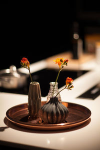 Close-up of flower vase on table