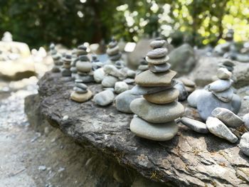 Close-up of stack of firewood on pebbles