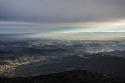 Aerial view of dramatic landscape against sky
