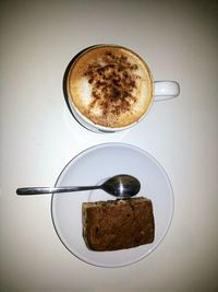 Directly above shot of cappuccino served on table