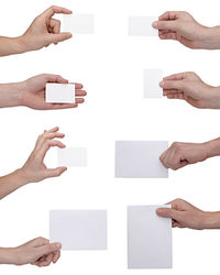 Digital composite image of hand holding paper against white background