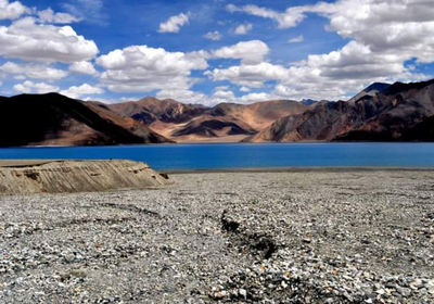 Scenic view of landscape against cloudy sky