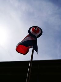 Low angle view of flag against sky