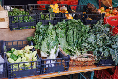 Shelves of a typical italian fruit and vegetable stand with vegetables for sale.