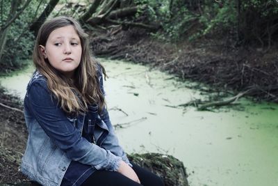 Portrait of teenage girl in water