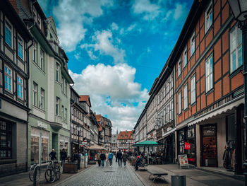 Street amidst buildings against sky