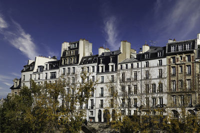 Buildings in city against sky