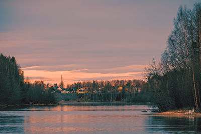 Scenic view of trees against sky during sunset