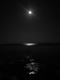 Scenic view of sea against sky at night