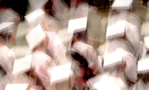 Defocused image of people walking in corridor