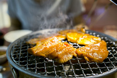 Close-up of meat on barbecue grill