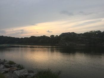 Scenic view of lake against sky during sunset