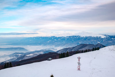 Sun over the winter mountains with snow, cindrel mountains, paltinis, romania