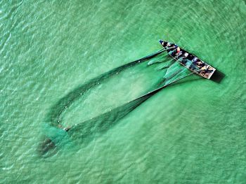 Aerial view of fisherman fishing in sea