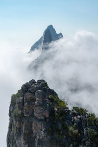 Rock formation on mountain against sky