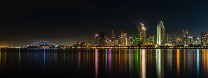 San diego by night with lights reflecting off the water of the bay