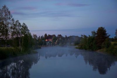 Scenic view of calm lake against sky