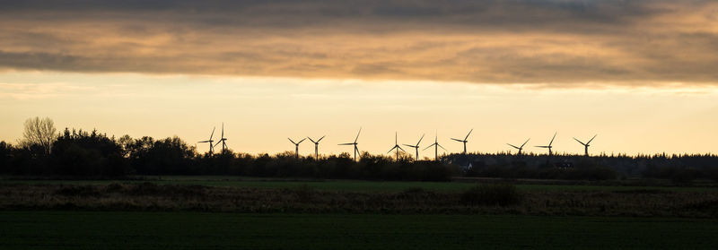 Scenic view of field against sky during sunset