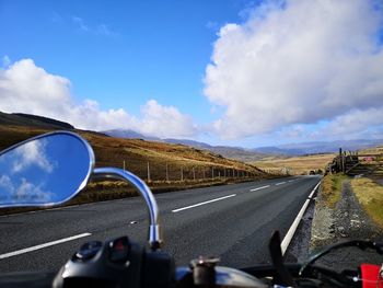 View of road against cloudy sky