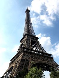 Low angle view of eiffel tower against blue sky