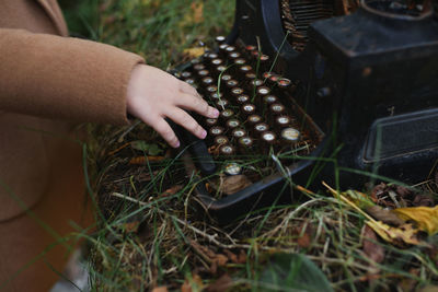 Midsection of woman using sound mixer