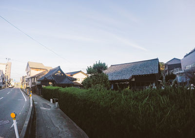 Road with buildings in background