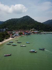 High angle view of boats in lake against sky