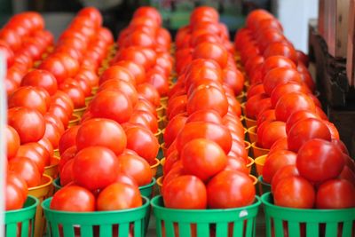 Tomatoes arranged in basket for sale