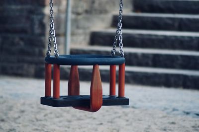 Close-up of empty swing in playground