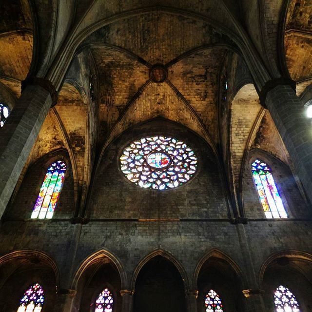 arch, indoors, church, religion, architecture, place of worship, spirituality, built structure, ceiling, low angle view, interior, stained glass, cathedral, window, ornate, no people, illuminated, history