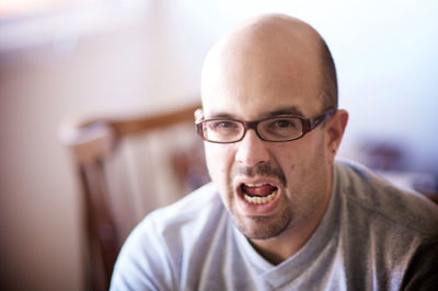 Portrait of man wearing eyeglasses