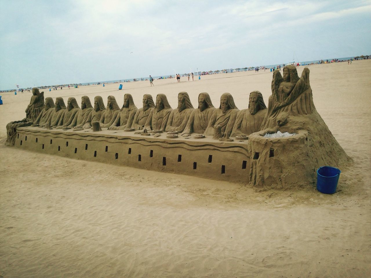 sky, beach, sea, built structure, architecture, sand, travel destinations, famous place, water, travel, cloud - sky, tourism, history, building exterior, ancient, old ruin, the past, shore, horizon over water, cloud