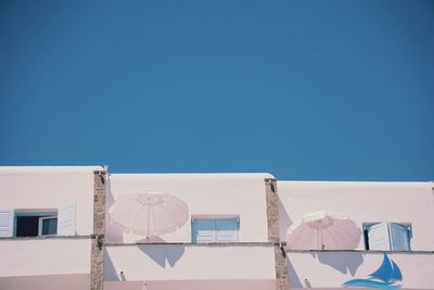 Low angle view of building against blue sky