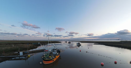 Sunset over boats in stone creek harbour, sunk island, east riding of yorkshire, uk