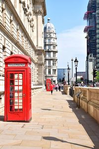 Telephone booth footpath in city