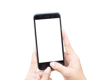 Midsection of person using mobile phone against white background