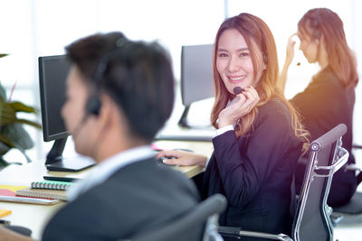 Portrait of customer service representative working in call center