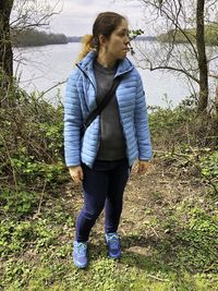 Full length of senior woman standing on field